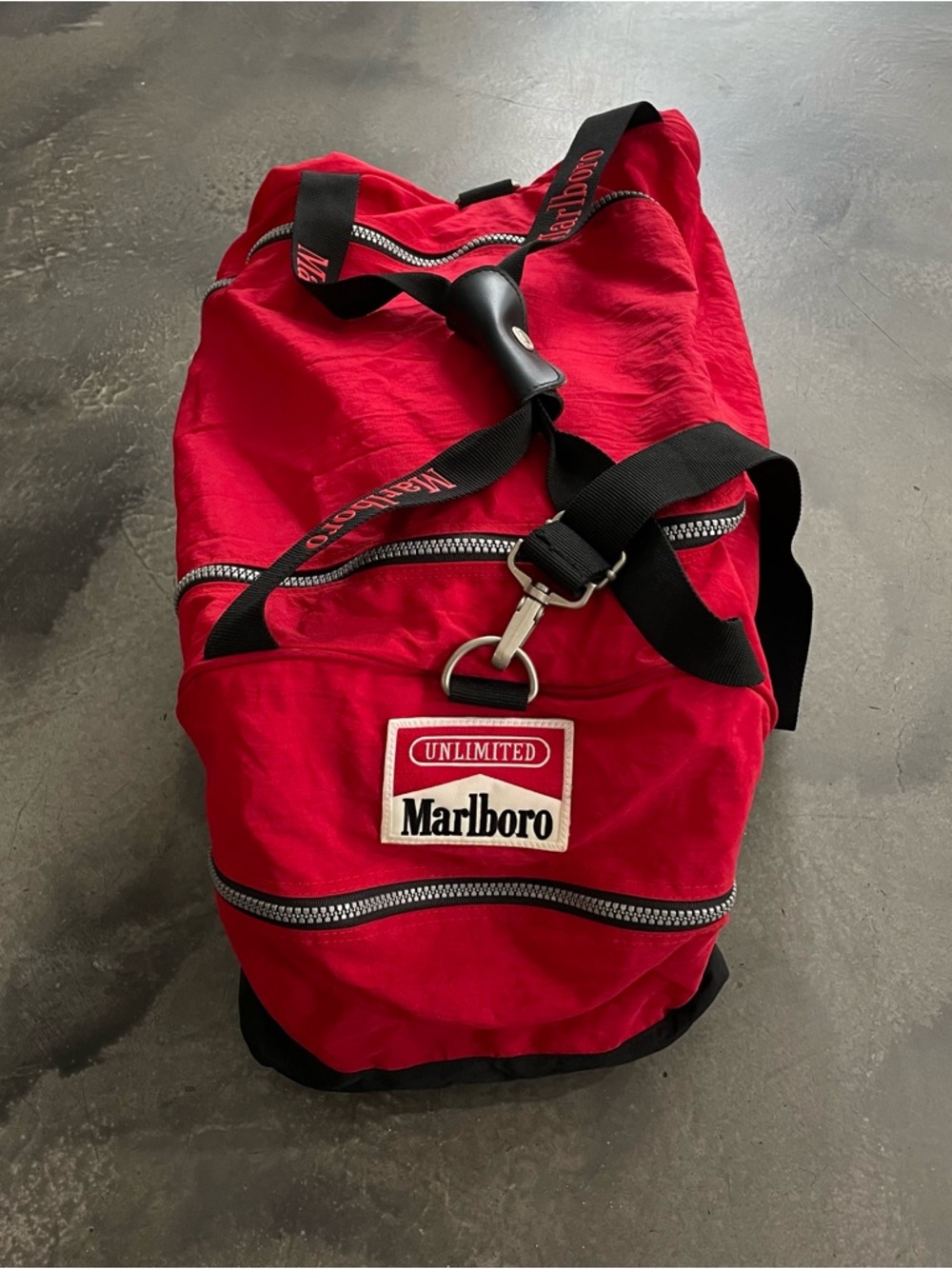 Marlboro Vintage Red Duffel Bag with Black Straps 21”x12x10” 
(Abr 026)